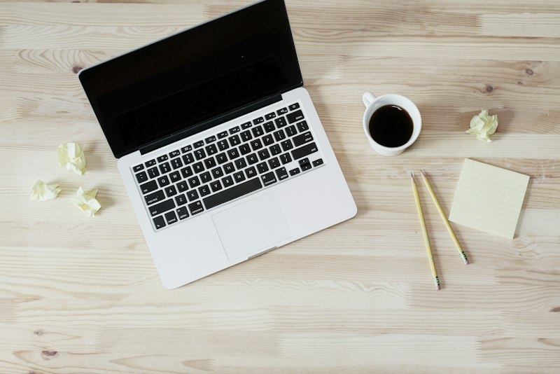 An open laptop on a clean white desk