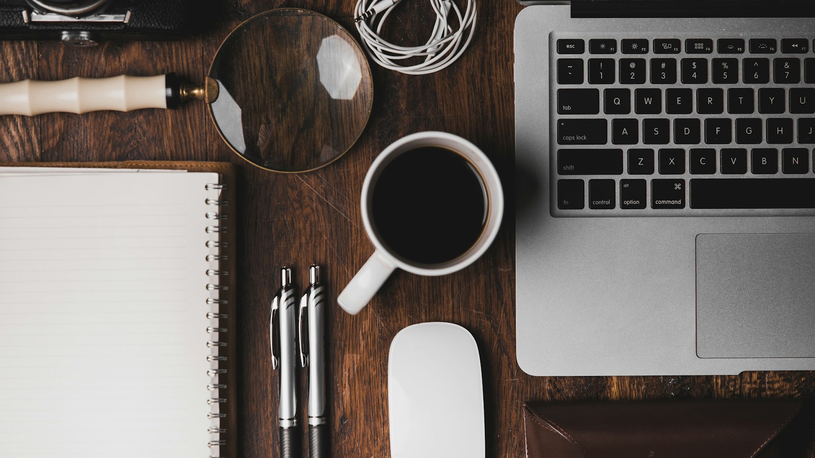 A tidy home-office desk with a laptop