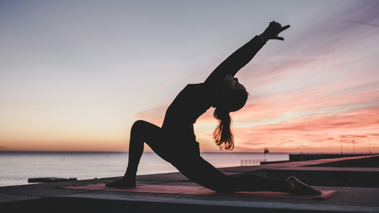 A person stretching during a break from work